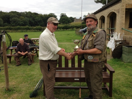 Eric Johnson presents the trophy to Brian Conway